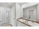 Bathroom featuring double sinks and neutral color palette at 1540 Denver Way, Locust Grove, GA 30248