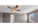 Large bedroom featuring a ceiling fan and a window providing natural light at 1540 Denver Way, Locust Grove, GA 30248