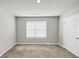 Neutral bedroom with large window letting in plenty of natural light at 1540 Denver Way, Locust Grove, GA 30248