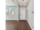Bright entryway boasts hardwood floors, neutral paint, a stylish light fixture, and a large window at 1540 Denver Way, Locust Grove, GA 30248