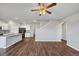 Spacious kitchen and living room area with bar seating and stainless appliances at 1540 Denver Way, Locust Grove, GA 30248