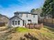 A view of the backyard with a wood deck, gray siding, and a privacy fence at 4152 Coconut Nw Grv, Acworth, GA 30101