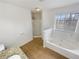 Bright bathroom featuring a soaking tub and separate shower at 4152 Coconut Nw Grv, Acworth, GA 30101