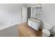 Bathroom featuring granite counters, a large mirror, and a soaking tub, offering relaxation and style at 4152 Coconut Nw Grv, Acworth, GA 30101