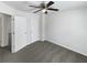 Neutral carpeted bedroom with ceiling fan, white walls, and a closet at 4152 Coconut Nw Grv, Acworth, GA 30101