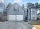 Inviting two-story home featuring a two-car garage, gray siding, and a well-maintained lawn at 4152 Coconut Nw Grv, Acworth, GA 30101