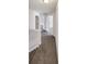Second floor hallway with carpeted floor, neutral walls, and multiple doors at 4152 Coconut Nw Grv, Acworth, GA 30101