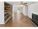 Spacious living room featuring a fireplace, hardwood floors, and wood accent wall at 4152 Coconut Nw Grv, Acworth, GA 30101