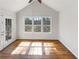 Bright sunroom featuring hardwood floors, a vaulted ceiling, and three large windows providing ample natural light at 4152 Coconut Nw Grv, Acworth, GA 30101