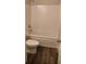 Clean and bright bathroom featuring a shower-tub combo and modern fixtures at 480 Brown Dove Ln, Grayson, GA 30017