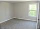 Bright bedroom with a large window allowing natural light to illuminate the space at 480 Brown Dove Ln, Grayson, GA 30017