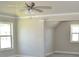 Cozy bedroom featuring two windows and a ceiling fan at 480 Brown Dove Ln, Grayson, GA 30017