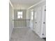 Hallway of the home with carpeted floor leading to bedrooms at 480 Brown Dove Ln, Grayson, GA 30017