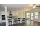 Open-concept kitchen featuring granite countertops, stainless steel appliances, and a stylish island at 480 Brown Dove Ln, Grayson, GA 30017