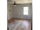 Bedroom featuring hardwood floors, a ceiling fan, and natural light through the window at 982 Scott Cir, Decatur, GA 30033