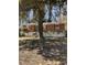 Charming single-story brick home with mature tree and walkway leading to the front door at 982 Scott Cir, Decatur, GA 30033