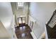 Grand foyer features hardwood floors, modern chandelier, large windows and lots of natural light at 11020 Bradford Ln, Suwanee, GA 30024