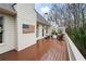 Outdoor deck area with patriotic decor, comfortable seating, and a lovely wooded view at 1207 Woodlawn Ne Dr, Marietta, GA 30068