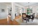 Open concept dining room showcasing hardwood floors and modern lighting fixtures at 1207 Woodlawn Ne Dr, Marietta, GA 30068