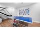 Game room with a ping pong table, an exercise machine and lots of pictures on the wall at 1207 Woodlawn Ne Dr, Marietta, GA 30068