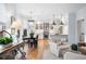 Bright eat-in kitchen area featuring a long dining table, modern appliances and countertops at 1207 Woodlawn Ne Dr, Marietta, GA 30068