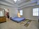 Bedroom featuring a tray ceiling, two windows and a walk in closet at 1326 Nantahala Ne Trl, Marietta, GA 30062