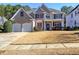 Beautifully landscaped front yard leads to this two story brick home with attached garage at 1326 Nantahala Ne Trl, Marietta, GA 30062