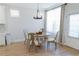 Charming dining area with a round table, stylish chairs, and ample natural light at 2141 Hempstead Ct, Snellville, GA 30078