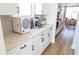 Bright white kitchen featuring stainless steel appliances and granite countertops at 2141 Hempstead Ct, Snellville, GA 30078