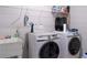 Laundry room featuring washer and dryer with utility sink at 2141 Hempstead Ct, Snellville, GA 30078