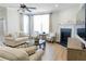 Bright and airy living room with a fireplace, neutral décor, and hardwood floors at 2141 Hempstead Ct, Snellville, GA 30078