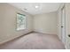 Cozy bedroom featuring soft carpeting, a window, and ample space, offering a blank canvas at 242 Meadow Spring Dr, Temple, GA 30179