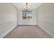 Formal dining room featuring elegant wainscoting and a chandelier, perfect for hosting dinners at 242 Meadow Spring Dr, Temple, GA 30179