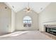 Bright living room with high ceilings and fireplace, featuring a large arched window at 242 Meadow Spring Dr, Temple, GA 30179