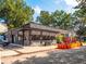 Exterior of a commercial building on a sunny day with sidewalk seating and large windows at 26 Ormond, Atlanta, GA 30315