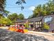 Exterior view of commercial building featuring sidewalk seating and ample street parking at 26 Ormond, Atlanta, GA 30315