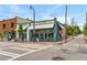 Attractive blue and white building with an awning, complemented by a sidewalk seating area and street view at 26 Ormond, Atlanta, GA 30315