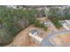Aerial view showcasing a house and its spacious lot, set within a community surrounded by lush greenery at 266 Carthage Blvd, Rockmart, GA 30153