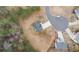 Aerial view showcasing the house, its surrounding lot, and the neighborhood layout with a cul-de-sac at 266 Carthage Blvd, Rockmart, GA 30153