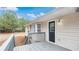 Cozy back deck featuring a gray railing and a black door, providing easy access to outdoor living at 266 Carthage Blvd, Rockmart, GA 30153
