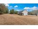 Large backyard featuring a spacious lawn and well-maintained lawn for outdoor enjoyment at 266 Carthage Blvd, Rockmart, GA 30153