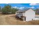 Well-maintained backyard with a deck, stairs, and ample space for outdoor activities and relaxation at 266 Carthage Blvd, Rockmart, GA 30153
