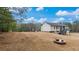 Expansive backyard with a fire pit and a well-maintained lawn, perfect for outdoor activities and relaxation at 266 Carthage Blvd, Rockmart, GA 30153