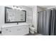 Bathroom featuring a shower, modern vanity with updated fixtures, and tiled floors at 266 Carthage Blvd, Rockmart, GA 30153