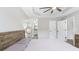 A lovely bedroom with a neutral palette, featuring tray ceilings, a ceiling fan, and a soft, inviting atmosphere at 266 Carthage Blvd, Rockmart, GA 30153