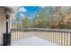 This is a deck with gray wood and railings that is a great place to hang out in the backyard at 266 Carthage Blvd, Rockmart, GA 30153