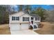 Charming split-level home featuring a two-car garage and a well-maintained lawn at 266 Carthage Blvd, Rockmart, GA 30153