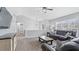 Bright living room with vaulted ceilings, a ceiling fan, and large windows at 266 Carthage Blvd, Rockmart, GA 30153