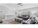 Bright living room with vaulted ceilings, a ceiling fan, and large windows at 266 Carthage Blvd, Rockmart, GA 30153