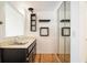 Wet bar area featuring a sink, cabinets, and mirrored wall at 795 Saddle Ridge Trce, Roswell, GA 30076